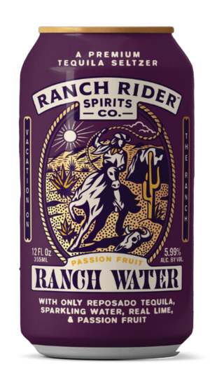 An image of the Passion Fruit Ranch Water pre-made cocktail can. The can is dark purple with blue, cream, and gold details. The label says "A premium tequila seltzer" at the top. Below that, there is an image of a cowboy on a horse with a rope on a desert backdrop. Below the logo, the label says: "Passion Fruit Ranch Water, with only reposado tequila, sparkling water, real lime and passion fruit."
