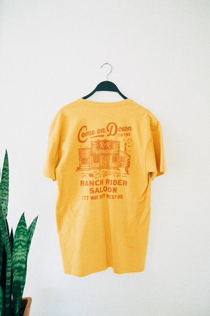 Yellow t-shirt with Ranch Rider design in red.